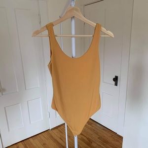 Yellow mustard bodysuit